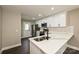 Well-lit kitchen with white cabinets, stainless appliances and marble countertops at 446 Mint St, Rock Hill, SC 29730