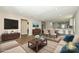 Inviting open-concept living area with wood floors, recessed lights and modern furnishings at 446 Mint St, Rock Hill, SC 29730