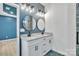 Modern bathroom features a double vanity with granite countertop and stylish round mirrors at 516 North Mulberry St, Cherryville, NC 28021