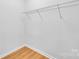 Walk-in closet with ample storage shelving and durable wood-look flooring at 516 North Mulberry St, Cherryville, NC 28021