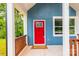 Charming covered front porch with blue siding and a bright red door at 516 North Mulberry St, Cherryville, NC 28021