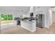 Modern kitchen featuring granite countertops, stainless steel appliances, white cabinetry, and a seamless transition to the outdoors at 516 North Mulberry St, Cherryville, NC 28021