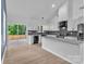 Modern kitchen with white cabinets, granite countertops, stainless steel appliances, and a stylish backsplash at 516 North Mulberry St, Cherryville, NC 28021