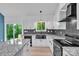 Well-equipped kitchen with granite counters, herringbone backsplash, and stainless appliances at 516 North Mulberry St, Cherryville, NC 28021