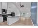 Open-concept living space with a modern kitchen, vaulted ceilings, and neutral walls enhancing the spacious and bright atmosphere at 516 North Mulberry St, Cherryville, NC 28021