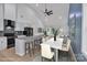 Open-concept living space with modern kitchen, dining area, and vaulted ceiling perfect for entertaining at 516 North Mulberry St, Cherryville, NC 28021