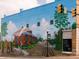 A bright and historic mural with local historical imagery at 516 North Mulberry St, Cherryville, NC 28021