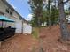 The backyard features a privacy fence and tree coverage at 5650 Kimmerly Woods Dr, Charlotte, NC 28215
