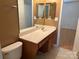 Bathroom with a large vanity, sink, and expansive mirror, providing a functional space at 5650 Kimmerly Woods Dr, Charlotte, NC 28215