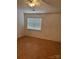 Bedroom featuring hardwood floors and a ceiling fan with a light at 5650 Kimmerly Woods Dr, Charlotte, NC 28215
