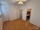 Bedroom with hardwood floors and ensuite bathroom at 5650 Kimmerly Woods Dr, Charlotte, NC 28215