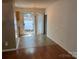 Bright dining area with sliding glass doors leading to a private outdoor space and classic chandelier lighting at 5650 Kimmerly Woods Dr, Charlotte, NC 28215