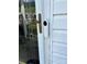 Front door featuring door hardware, glass, and security camera at 5650 Kimmerly Woods Dr, Charlotte, NC 28215