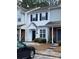 Charming townhome with neat landscaping, covered entrance and black shutters at 5650 Kimmerly Woods Dr, Charlotte, NC 28215