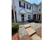 Inviting front entrance of a well-maintained townhouse with a small garden area at 5650 Kimmerly Woods Dr, Charlotte, NC 28215