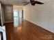 Open-concept layout with laminate floors leading to a sliding glass door at 5650 Kimmerly Woods Dr, Charlotte, NC 28215