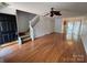 Spacious living room with hardwood floors and access to the stairway and kitchen at 5650 Kimmerly Woods Dr, Charlotte, NC 28215
