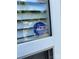 Window with security decal showing secured by ADT at 5650 Kimmerly Woods Dr, Charlotte, NC 28215