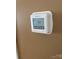 A home thermostat is mounted on the neutral wall at 5650 Kimmerly Woods Dr, Charlotte, NC 28215