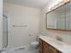 Bathroom featuring a single sink vanity, toilet, and shower at 5720 Amity Pl, Charlotte, NC 28212