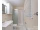 Cozy bathroom with tiled shower, vanity, and neutral color scheme at 5720 Amity Pl, Charlotte, NC 28212