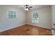 Bedroom featuring hardwood flooring and two windows at 5720 Amity Pl, Charlotte, NC 28212