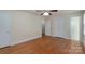 Spacious bedroom with hardwood floors, ceiling fan, and ample closet space at 5720 Amity Pl, Charlotte, NC 28212