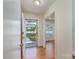 Bright foyer with gleaming hardwood floors offers a view of the front yard, showcasing a seamless transition to the home's interior at 5720 Amity Pl, Charlotte, NC 28212