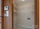 Laundry room featuring shelving and tile flooring at 5720 Amity Pl, Charlotte, NC 28212