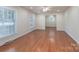 Bright living room with gleaming hardwood floors and ample natural light, creating a warm and inviting space for relaxation at 5720 Amity Pl, Charlotte, NC 28212