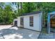 Exterior of detached shed, side view with wood siding at 5720 Amity Pl, Charlotte, NC 28212