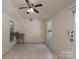 View of a utility room featuring tile flooring and a stainless steel sink at 5720 Amity Pl, Charlotte, NC 28212