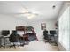 Spacious bedroom with bunk beds, ceiling fan, two computer stations, and a bright window with blinds at 5916 Four Wood Dr, Matthews, NC 28104