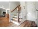 Welcoming entryway with wood stairs and door at 5916 Four Wood Dr, Matthews, NC 28104
