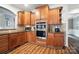 Modern kitchen with stainless steel appliances, granite countertops, and ample cabinetry at 5916 Four Wood Dr, Matthews, NC 28104