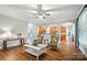 Open-concept living room with hardwood floors, neutral paint, and large archways to the kitchen at 5916 Four Wood Dr, Matthews, NC 28104