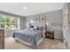 A well-lit bedroom with a large window and stylish decor provides a relaxing and comfortable space at 5995 Granbury Dr, Kannapolis, NC 28081