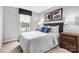 Cozy bedroom featuring plush carpeting, modern decor, and an abundance of natural light at 5995 Granbury Dr, Kannapolis, NC 28081