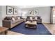 Spacious living area with plush seating, elegant decor, and ample natural light at 5995 Granbury Dr, Kannapolis, NC 28081