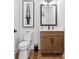 Neutral bathroom with a sleek modern vanity and contemporary fixtures; perfect for guests at 6020 Waldorf Ave, Monroe, NC 28110