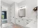 This bright bathroom with quartz countertops and modern fixtures offers space and style at 6020 Waldorf Ave, Monroe, NC 28110