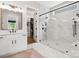 A well-appointed bathroom featuring a glass shower and a walk-in closet at 6020 Waldorf Ave, Monroe, NC 28110