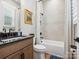 This traditional bathroom features a tub and shower combination with dark fixtures at 6020 Waldorf Ave, Monroe, NC 28110