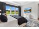 This cozy bedroom includes large window, dresser with a TV, and modern decor at 6020 Waldorf Ave, Monroe, NC 28110