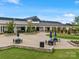 The grand clubhouse is framed by manicured lawns and inviting outdoor seating areas at 6020 Waldorf Ave, Monroe, NC 28110