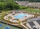 Aerial view of the resort-style pool and lounge area, surrounded by well-maintained landscaping at 6020 Waldorf Ave, Monroe, NC 28110
