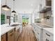 Well-lit kitchen featuring modern appliances, custom cabinetry, and a view to a dining area at 6020 Waldorf Ave, Monroe, NC 28110
