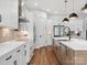 Bright kitchen with stainless steel appliances, custom cabinetry, and a spacious center island at 6020 Waldorf Ave, Monroe, NC 28110