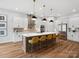 The kitchen features a large island, modern appliances, and elegant pendant lighting at 6020 Waldorf Ave, Monroe, NC 28110