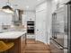 Modern kitchen with stainless steel appliances, white cabinetry, and a spacious island with seating at 6020 Waldorf Ave, Monroe, NC 28110